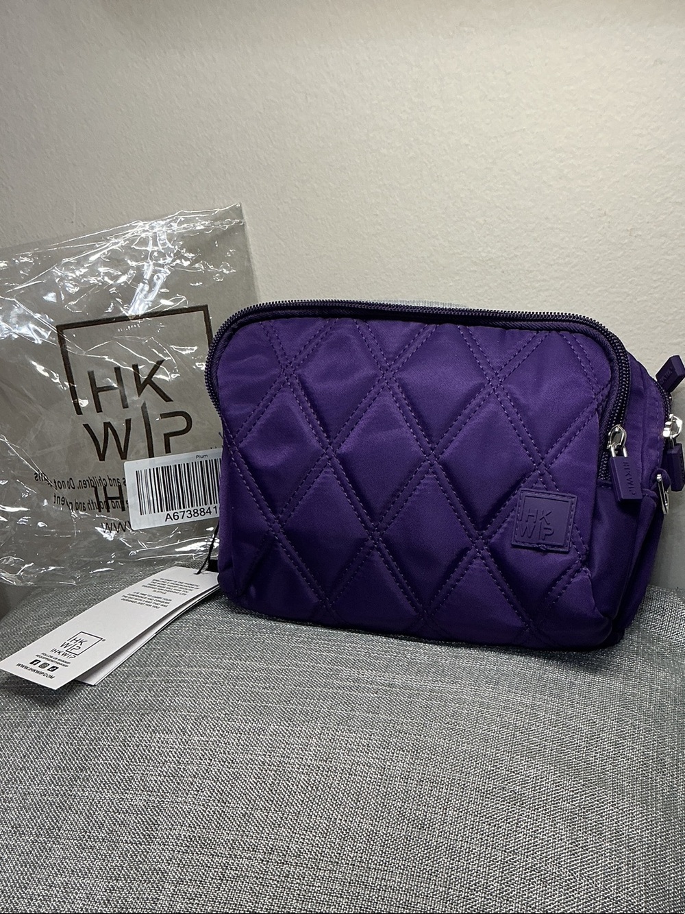 Plum Ihkwip crossbody or wristlet bag